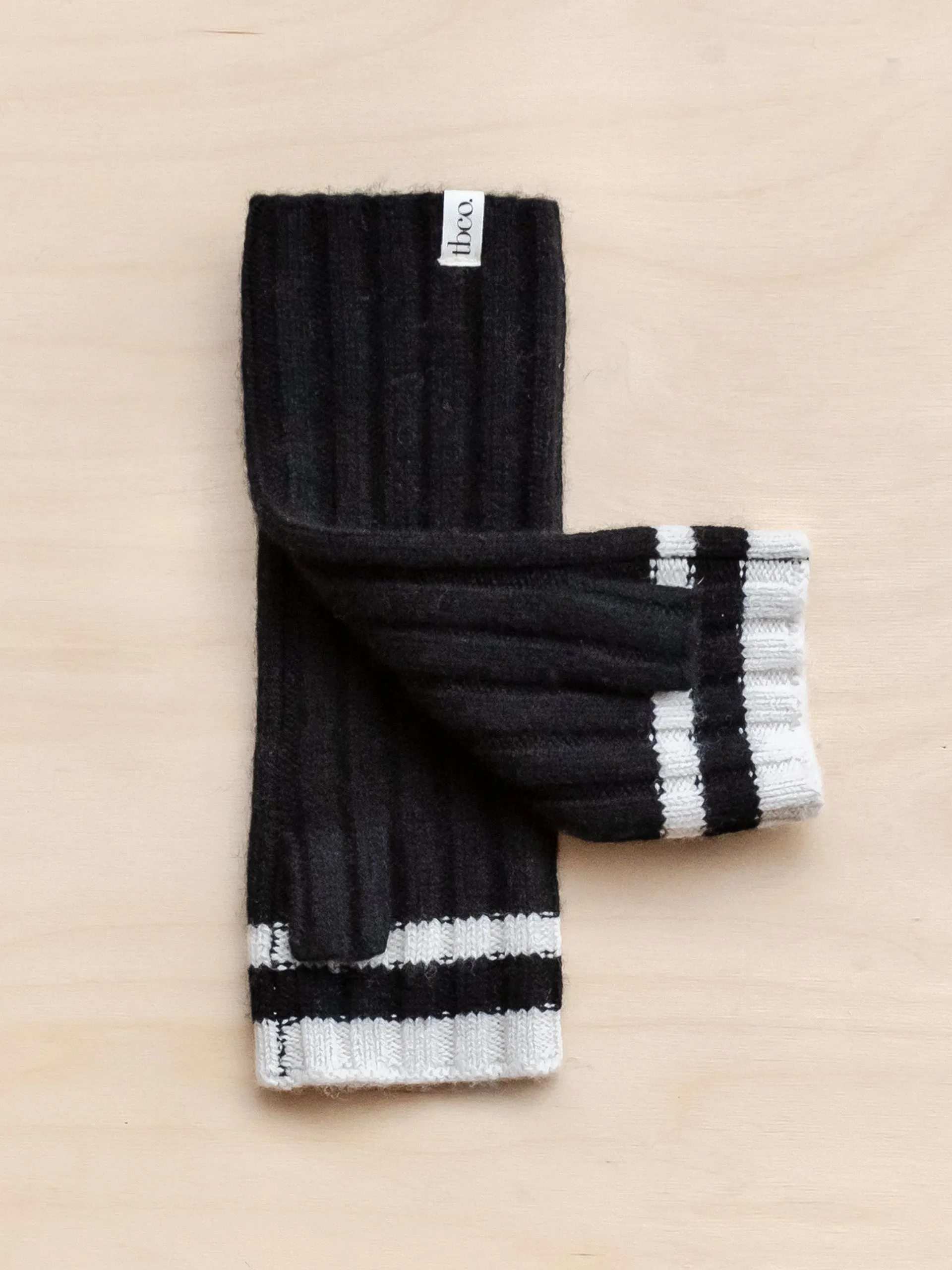 Cashmere and merino wrist warmers in black and cream