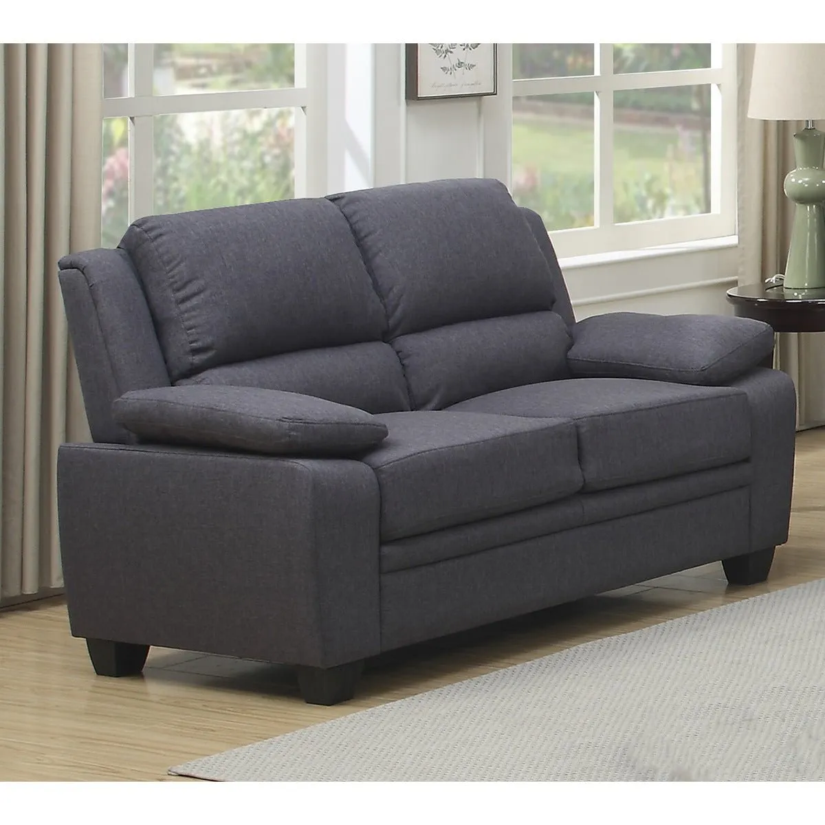 Grey Fabric Love Seat With High Back And Pillows Over The Arms